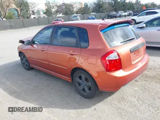 2007 Kia Spectra with VIN KNAFE161275003137, listed as a IAAI auction lot 41697530 with 256,834 mi miles. Bid and sale history available at carsss.com. Image 3.