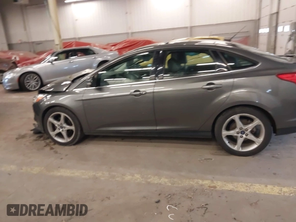 2013 Ford Focus Titanium with VIN 1FADP3J23DL265049, listed as a IAAI auction lot 41765621 with 100,550 mi miles and . Bid and sale history available at carsss.com. Image 14.