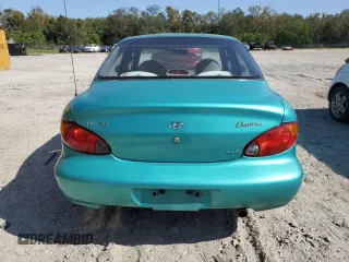 2000 Hyundai Elantra GLS z VIN KMHJF35FXYU998689, wystawiony jako Copart lot #76181814 z przebiegiem 154 743 mil mil oraz Szkoda całkowita • Salvage title. Historia ofert i sprzedaży dostępna na DreamBid. Obrazek 6.