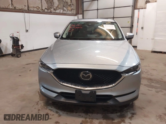 2021 Mazda CX-5 Grand Touring with VIN JM3KFADMXM1318015, listed as a IAAI auction lot 41221528 with 79,473 mi miles. Bid and sale history available at carsss.com. Image 12.