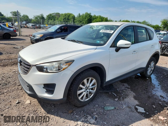 2016 Mazda CX-5 Sport with VIN JM3KE4BYXG0704194, listed as a Copart auction lot 62095735 with 93,970 mi miles and Salvage title. Bid and sale history available at DreamBid. Image 1.