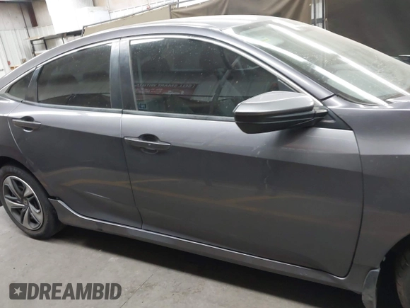 2020 Honda Civic LX with VIN 19XFC2F67LE006057, listed as a IAAI auction lot 42032759 with 119,319 mi miles and . Bid and sale history available at DreamBid. Image 14.