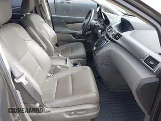 2015 Honda Odyssey Touring Elite z VIN 5FNRL5H97FB060981, wystawiony jako IAAI lot #42289631 z przebiegiem 160 947 mil mil oraz . Historia ofert i sprzedaży dostępna na DreamBid. Obrazek 5.