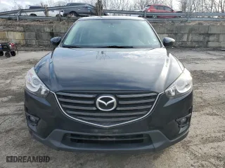 2016 Mazda CX-5 Touring with VIN JM3KE4CY7G0860868, listed as a Copart auction lot 51203415 with 86,768 mi miles and Salvage Title. Bid and sale history available at carsss.com. Image 5.