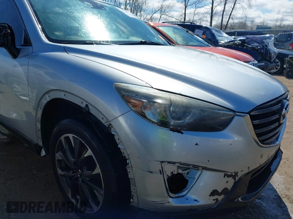 2016 Mazda CX-5 Grand Touring with VIN JM3KE4DY9G0795360, listed as a IAAI auction lot 41933991 with 176,373 mi miles. Bid and sale history available at carsss.com. Image 6.