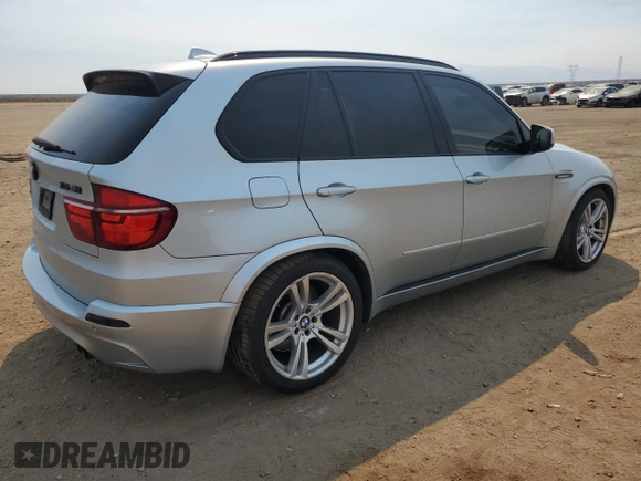 2011 BMW X5 M with VIN 5YMGY0C58BLK26357, listed as a Copart auction lot 71443774 with 116,973 mi miles and Salvage Title. Bid and sale history available at carsss.com. Image 3.