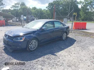 2014 Volkswagen Jetta TDI w/Premium/Nav with VIN 3VWLL7AJ3EM381929, listed as a IAAI auction lot 42539178 with 101,851 mi miles and . Bid and sale history available at DreamBid. Image 2.