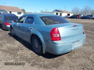 2009 Chrysler 300 LX with VIN 2C3KA43D19H552759, listed as a IAAI auction lot 41702989 with 172,572 mi miles. Bid and sale history available at carsss.com. Image 3.