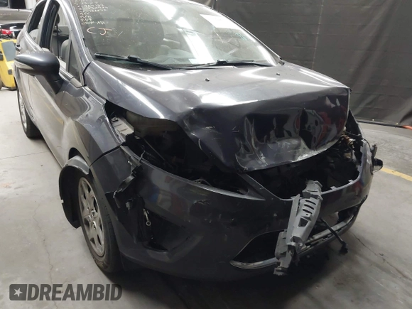 2013 Ford Fiesta SE z VIN 3FADP4BJ1DM186232, wystawiony jako IAAI lot #42304613 z przebiegiem 105 919 mil mil oraz . Historia ofert i sprzedaży dostępna na DreamBid. Obrazek 6.