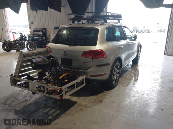 2011 Volkswagen Touareg Exec with VIN WVGFK9BP4BD005986, listed as a IAAI auction lot 41183877 with 109,005 mi miles and . Bid and sale history available at DreamBid. Image 4.