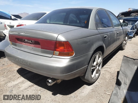 1999 Saturn SL z VIN 1G8ZK5271XZ316032, wystawiony jako Copart lot #50663015 z przebiegiem 164 288 mil mil oraz Nie do naprawy • Non repairable. Historia ofert i sprzedaży dostępna na DreamBid. Obrazek 3.