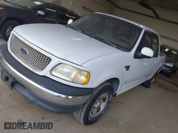 2001 Ford F-150 XLT with VIN 1FTRW07LX1KD77186, listed as a IAAI auction lot 42564774 with 190,647 mi miles and . Bid and sale history available at DreamBid. Image 2.