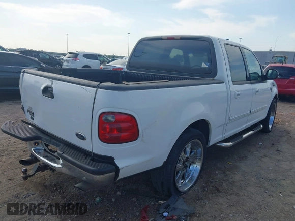 2001 Ford F-150 XLT with VIN 1FTRW07L81KE91672, listed as a IAAI auction lot 42021661 with 200,000 mi miles and . Bid and sale history available at DreamBid. Image 4.