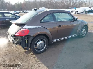 2012 Volkswagen Beetle 2.5L PZEV with VIN 3VWJP7AT9CM609099, listed as a IAAI auction lot 41396554 with 151,393 mi miles. Bid and sale history available at carsss.com. Image 4.