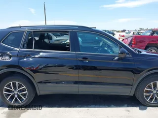 2021 Volkswagen Tiguan S with VIN 3VV1B7AX9MM067347, listed as a IAAI auction lot 42305101 with 77,042 mi miles and . Bid and sale history available at DreamBid. Image 13.