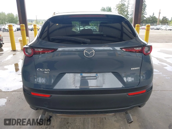 2023 Mazda CX-30 S Carbon Edition with VIN 3MVDMBCM1PM558865, listed as a IAAI auction lot 42298416 with 19,276 mi miles and . Bid and sale history available at DreamBid. Image 17.