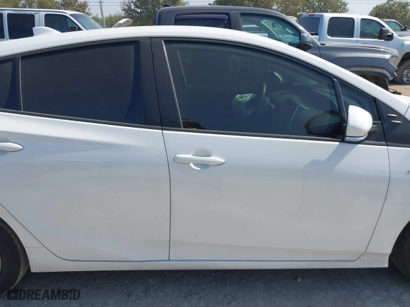 2021 Toyota Prius L Eco with VIN JTDKAMFU6M3141263, listed as a IAAI auction lot 40593951 with 95,921 mi miles. Bid and sale history available at carsss.com. Image 13.