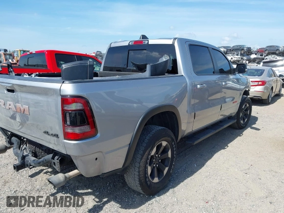 2022 Ram 1500 Rebel z VIN 1C6SRFLT2NN351050, wystawiony jako IAAI lot #41976882 z przebiegiem 59 490 mil mil oraz . Historia ofert i sprzedaży dostępna na DreamBid. Obrazek 4.