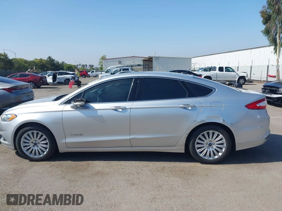 2016 Ford Fusion SE Hybrid z VIN 3FA6P0LU8GR203934, wystawiony jako IAAI lot #42595741 z przebiegiem 84 189 mil mil oraz . Historia ofert i sprzedaży dostępna na DreamBid. Obrazek 15.