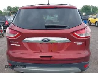 2015 Ford Escape Titanium z VIN 1FMCU9J98FUC84963, wystawiony jako IAAI lot #42469112 z przebiegiem 128 838 mil mil oraz . Historia ofert i sprzedaży dostępna na DreamBid. Obrazek 16.