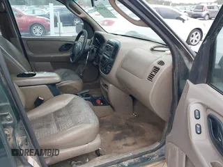2002 Ford Escape with VIN 1FMCU02132KD51298, listed as a IAAI auction lot 41550132 with 218,830 mi miles and . Bid and sale history available at DreamBid. Image 5.