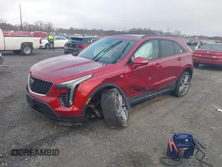 2021 Cadillac XT4 AWD Sport with VIN 1GYFZFR43MF006039, listed as a IAAI auction lot 41845105 with 19,289 mi miles and . Bid and sale history available at DreamBid. Image 2.