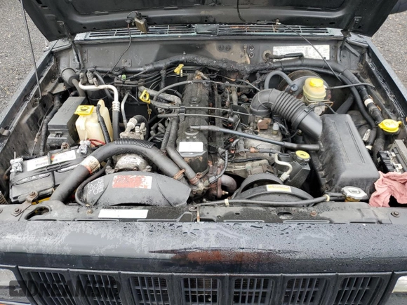 1999 Jeep Cherokee Sport with VIN 1J4FF68S8XL671341, listed as a Copart auction lot 58136475 with 139,848 mi miles and Salvage title. Bid and sale history available at DreamBid. Image 12.