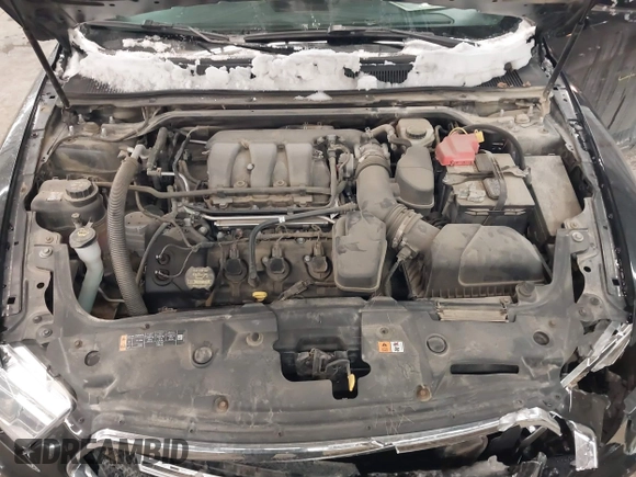 2014 Ford Taurus SEL with VIN 1FAHP2E87EG117653, listed as a IAAI auction lot 41589415 with 125,040 mi miles. Bid and sale history available at carsss.com. Image 10.