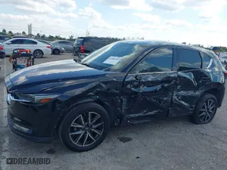 2018 Mazda CX-5 Grand Touring with VIN JM3KFBDM2J0390611, listed as a IAAI auction lot 42006482 with 97,497 mi miles. Bid and sale history available at carsss.com. Image 6.