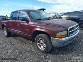 2002 Dodge Dakota SLT with VIN 1B7HL48N32S716822, listed as a IAAI auction lot 41587416 with 216,201 mi miles. Bid and sale history available at carsss.com. Image 1.