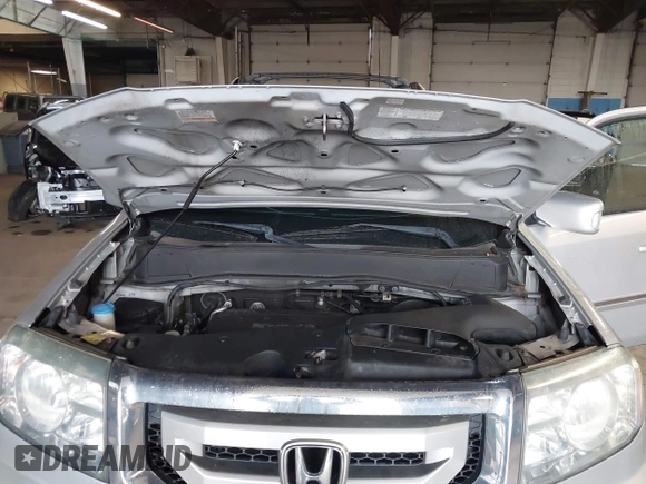 2009 Honda Pilot Touring with VIN 5FNYF48929B010331, listed as a IAAI auction lot 41965094 with 142,490 mi miles and . Bid and sale history available at carsss.com. Image 10.