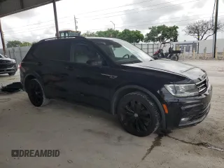 2021 Volkswagen Tiguan SE with VIN 3VV3B7AX4MM095257, listed as a Copart auction lot 60690015 with 61,782 mi miles and Salvage title. Bid and sale history available at DreamBid. Image 4.