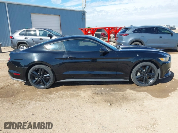 2015 Ford Mustang EcoBoost z VIN 1FA6P8TH9F5355840, wystawiony jako IAAI lot #42552910 z przebiegiem 96 422 mil mil oraz . Historia ofert i sprzedaży dostępna na DreamBid. Obrazek 13.
