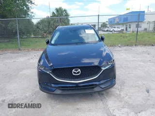 2017 Mazda CX-5 Touring with VIN JM3KFACL0H0227615, listed as a IAAI auction lot 42063618 with 72,291 mi miles. Bid and sale history available at carsss.com. Image 6.