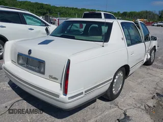 1999 Cadillac DeVille z VIN 1G6KD54Y3XU712969, wystawiony jako IAAI lot #42344041 z przebiegiem 169 572 mil mil oraz . Historia ofert i sprzedaży dostępna na DreamBid. Obrazek 4.