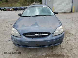 2000 Ford Taurus SE z VIN 1FAFP53U5YA259273, wystawiony jako Copart lot #52787305 z przebiegiem 234 848 mil mil oraz Szkoda całkowita • Salvage title. Historia ofert i sprzedaży dostępna na DreamBid. Obrazek 5.