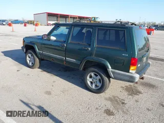 1999 Jeep Cherokee Sport with VIN 1J4FF68SXXL677013, listed as a IAAI auction lot 41993355 with 228,722 mi miles. Bid and sale history available at carsss.com. Image 3.