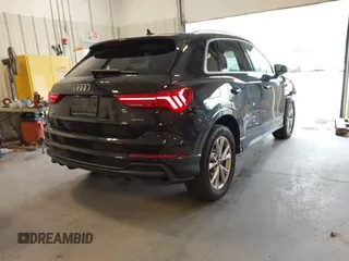 2021 Audi Q3 S line Premium Plus with VIN WA1EECF32M1054629, listed as a IAAI auction lot 41588322 with 33,385 mi miles and . Bid and sale history available at DreamBid. Image 4.