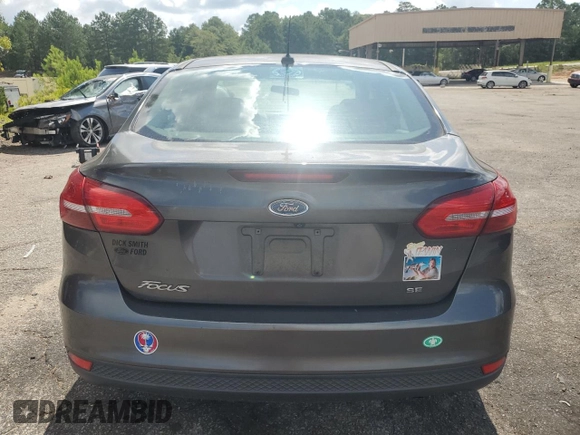 2017 Ford Focus SE with VIN 1FADP3F21HL251357, listed as a Copart auction lot 65214535 with 76,895 mi miles and Clean title. Bid and sale history available at DreamBid. Image 6.