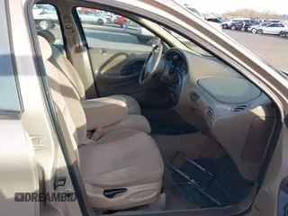 1999 Ford Taurus SE with VIN 1FAFP53U4XG223246, listed as a IAAI auction lot 41570969 with 59,064 mi miles. Bid and sale history available at carsss.com. Image 5.