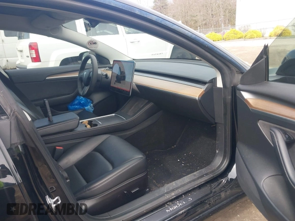 2022 Tesla Model 3 Long Range with VIN 5YJ3E1EBXNF177128, listed as a IAAI auction lot 41966089 with 75,140 mi miles and . Bid and sale history available at DreamBid. Image 5.