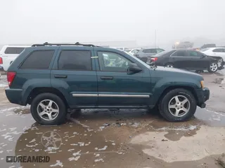 2005 Jeep Grand Cherokee Laredo with VIN 1J4GS48K45C677011, listed as a IAAI auction lot 41121018 with 210,814 mi miles. Bid and sale history available at carsss.com. Image 13.