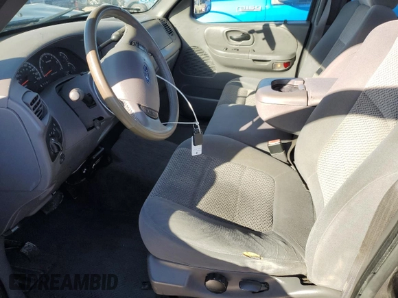 2003 Ford F-150 XLT with VIN 1FTRW08673KA38056, listed as a Copart auction lot 42772435 with 129,104 mi miles and Salvage Title. Bid and sale history available at carsss.com. Image 7.
