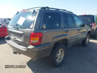 1999 Jeep Grand Cherokee Limited with VIN 1J4GW68N7XC617687, listed as a IAAI auction lot 42433705 with 186,312 mi miles and . Bid and sale history available at DreamBid. Image 4.