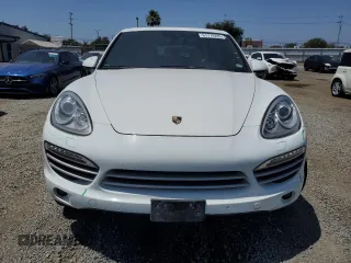 2014 Porsche Cayenne with VIN WP1AA2A28ELA09742, listed as a Copart auction lot 61779285 with 182,380 mi miles and Salvage title. Bid and sale history available at DreamBid. Image 5.