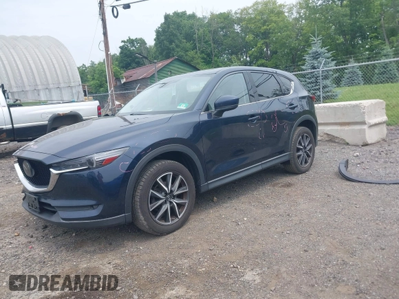 2018 Mazda CX-5 Grand Touring with VIN JM3KFBDMXJ0361812, listed as a IAAI auction lot 42509752 with 131,386 mi miles and . Bid and sale history available at DreamBid. Image 18.