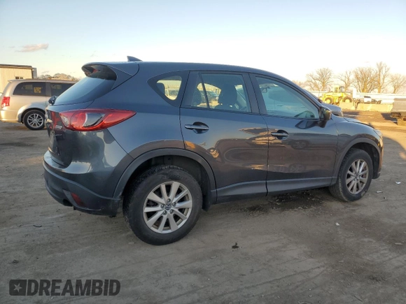 2016 Mazda CX-5 Sport with VIN JM3KE2BY9G0771969, listed as a Copart auction lot 80966064 with 99,348 mi miles and Salvage title. Bid and sale history available at DreamBid. Image 3.