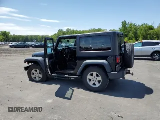 2014 Jeep Wrangler Sport with VIN 1C4AJWAG2EL113843, listed as a Copart auction lot 62771115 with 70,089 mi miles and Salvage title. Bid and sale history available at DreamBid. Image 2.