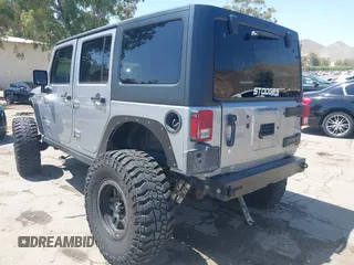 2018 Jeep Wrangler Unlimited Sport with VIN 1C4BJWDG4JL807265, listed as a IAAI auction lot 42520648 with 69,229 mi miles and . Bid and sale history available at DreamBid. Image 3.