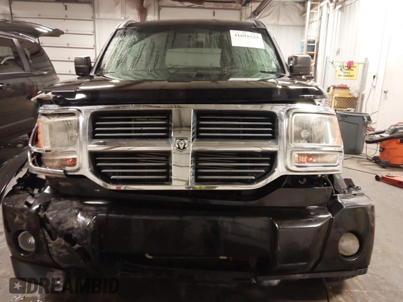 2007 Dodge Nitro SXT with VIN 1D8GU28K67W663621, listed as a IAAI auction lot 41691529 with 211,556 mi miles. Bid and sale history available at carsss.com. Image 6.